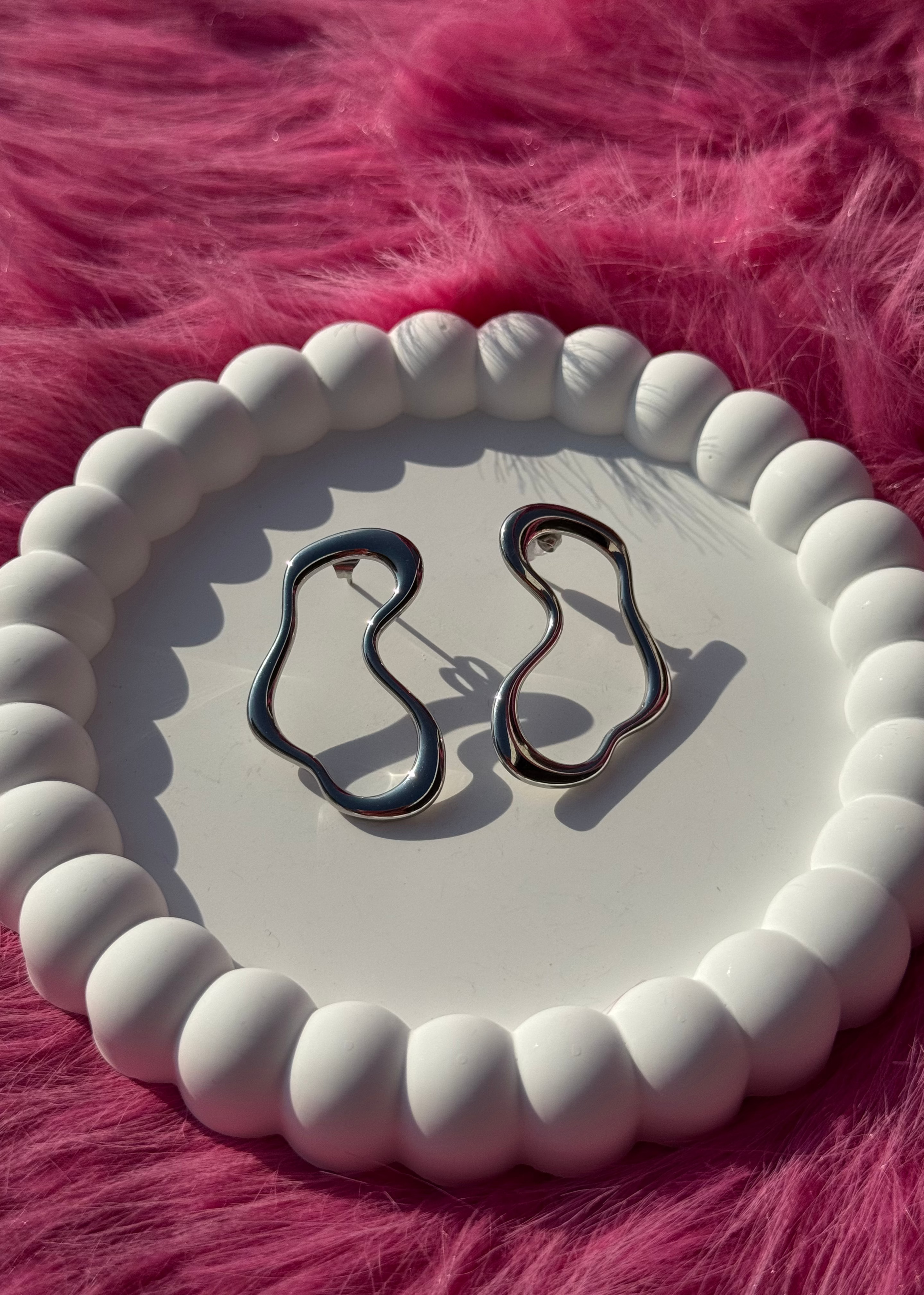 Lost shaped earrings gilded in 925 Silver