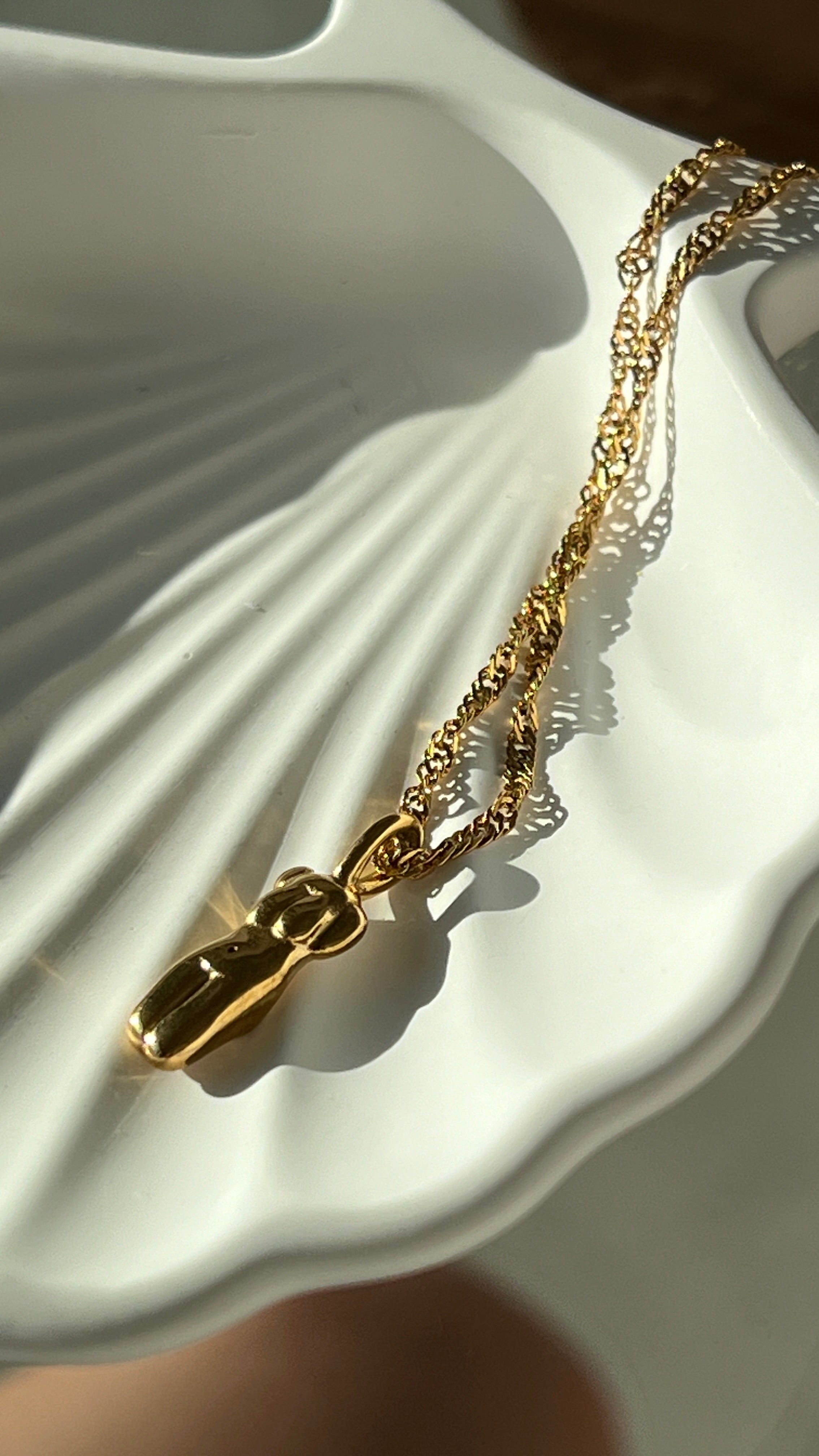 Sculptural pendant charm gilded in 18 Carat Gold